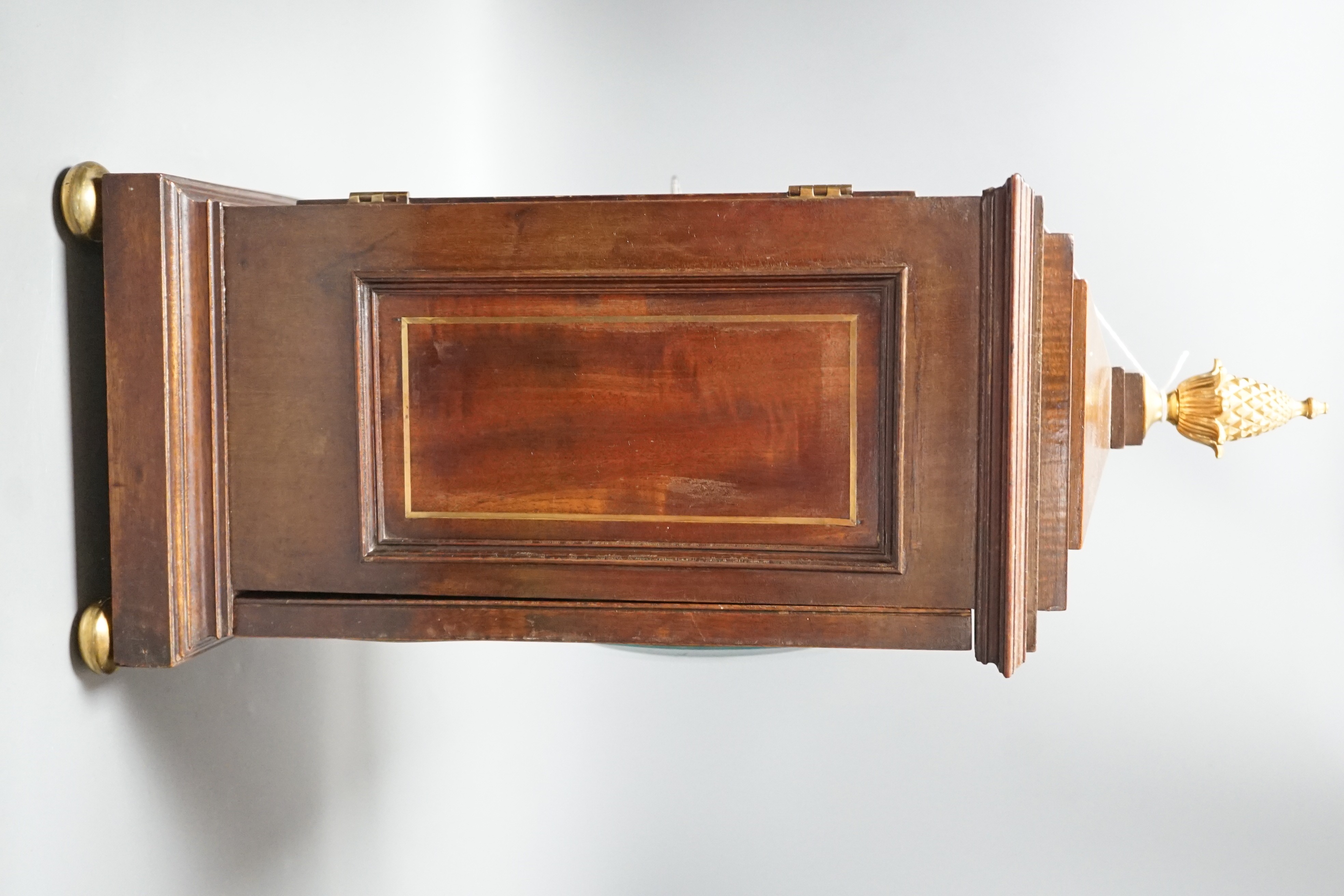 A Regency brass inlaid mahogany bracket clock, with pineapple finial, bears interior paper label Cuss & Co. 49cm high